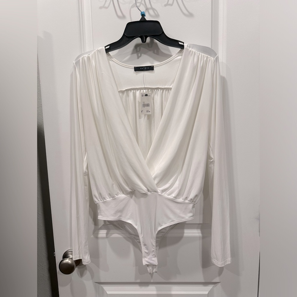 White low cut bodysuit. Never been worn and tag still on!